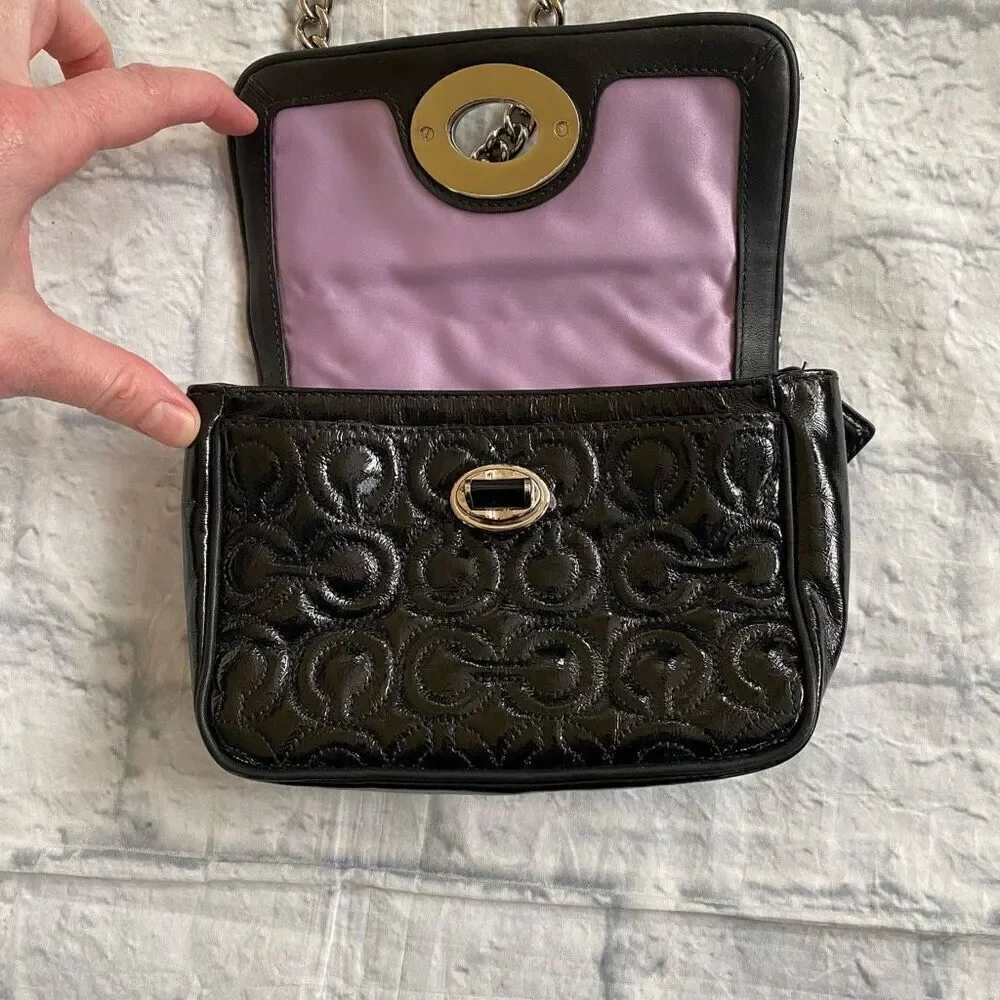 Coach mini shoulder/crossbody bag w/twist latch closure w/satin inner lining